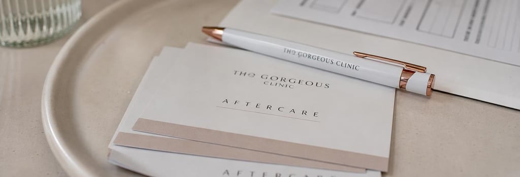 Photorealistic close-up of aftercare cards and a clinic pen on a cream ceramic tray, consultation form without readable text, shallow depth-of-field, editorial training detail